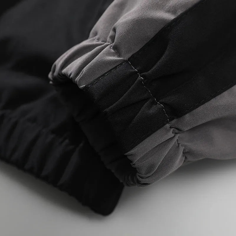 Men's black casual polyester jacket with contrast stitching and side seam pockets.