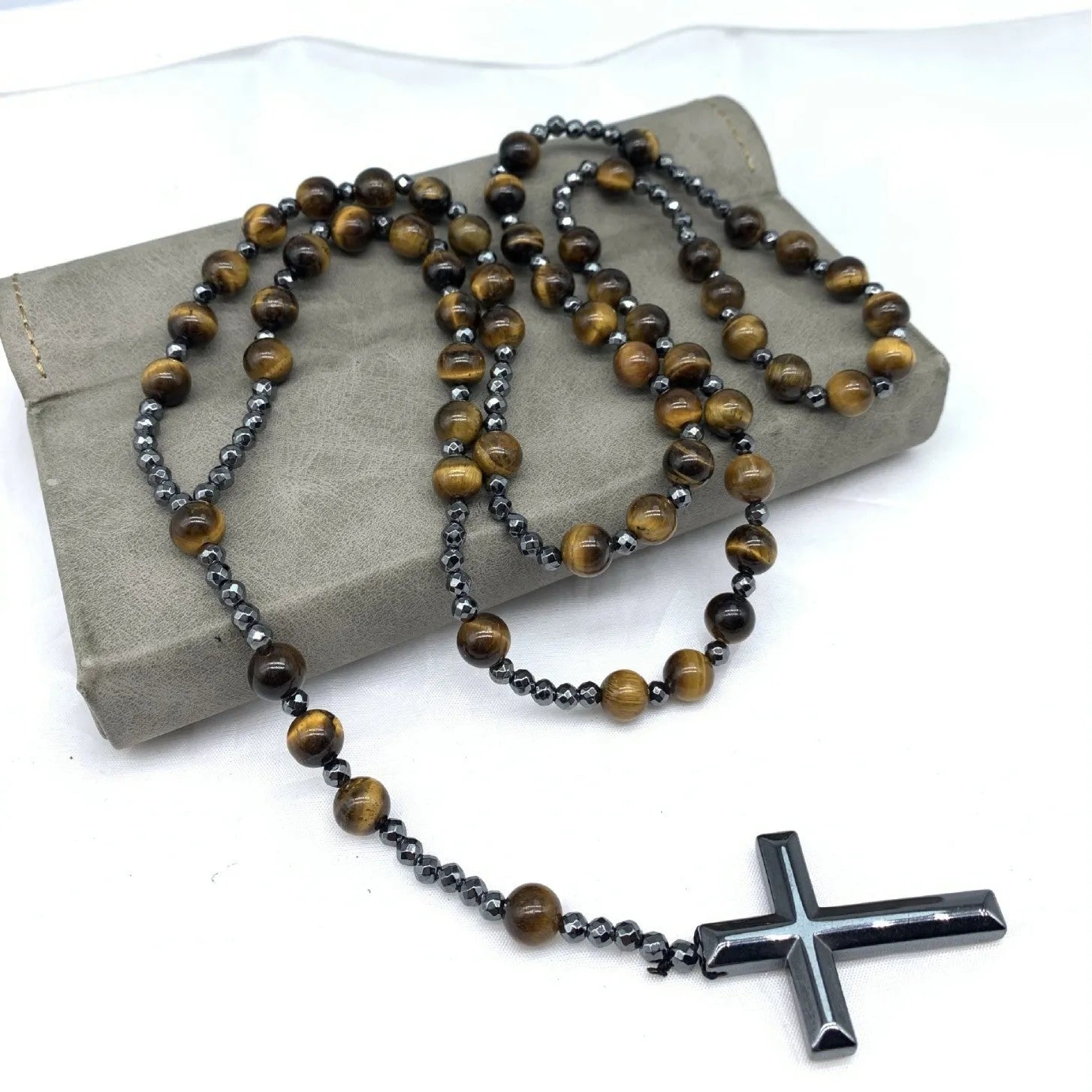 Men's stone cross pendant necklace with hand-woven detail on an 80cm ball bead chain.