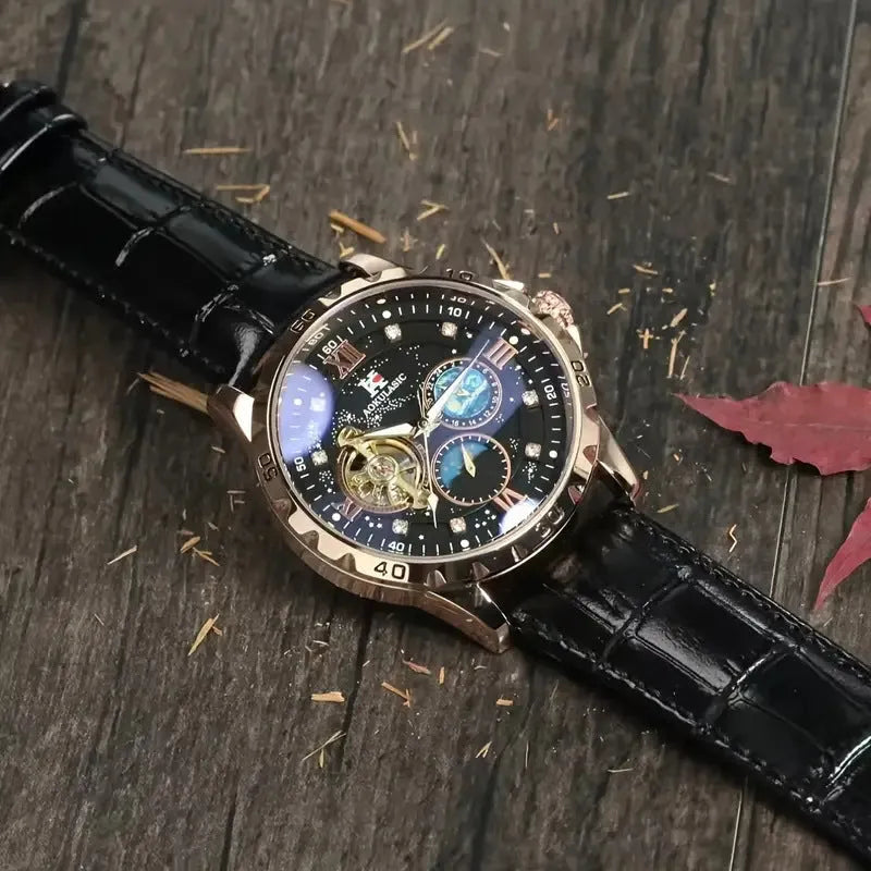 Automatic mechanical watch with large hollow dial showing movement, rose gold case, black face, leather strap