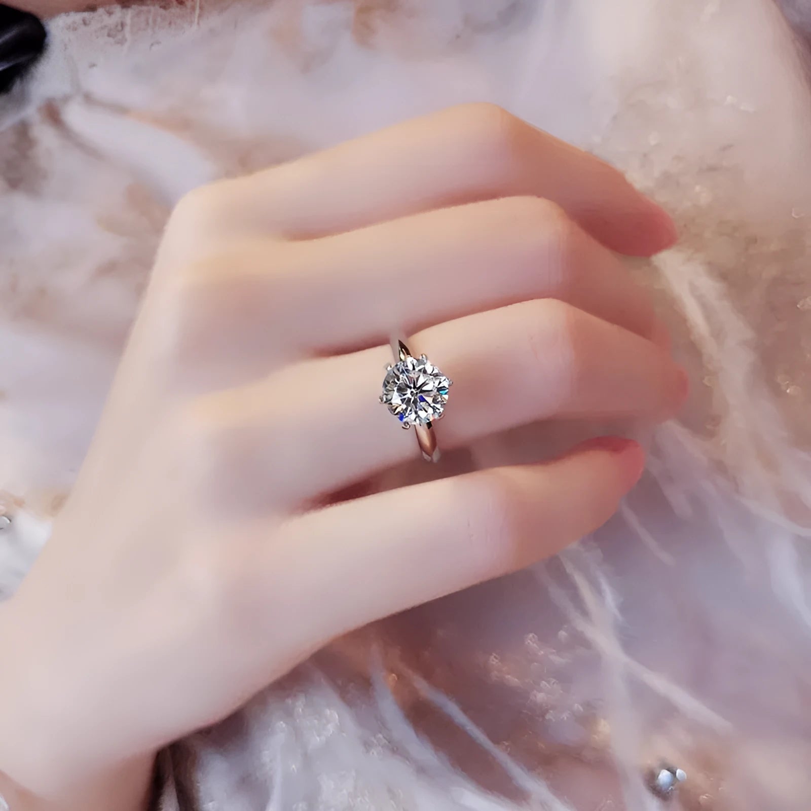 White gold plated geometric ring with a six-claw setting holding a central zircon stone.