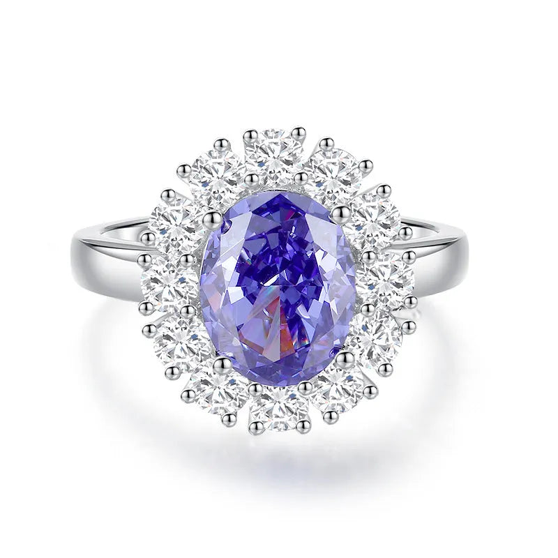 Heart shaped Tanzanite purple zircon ring in sterling silver on a grey background.