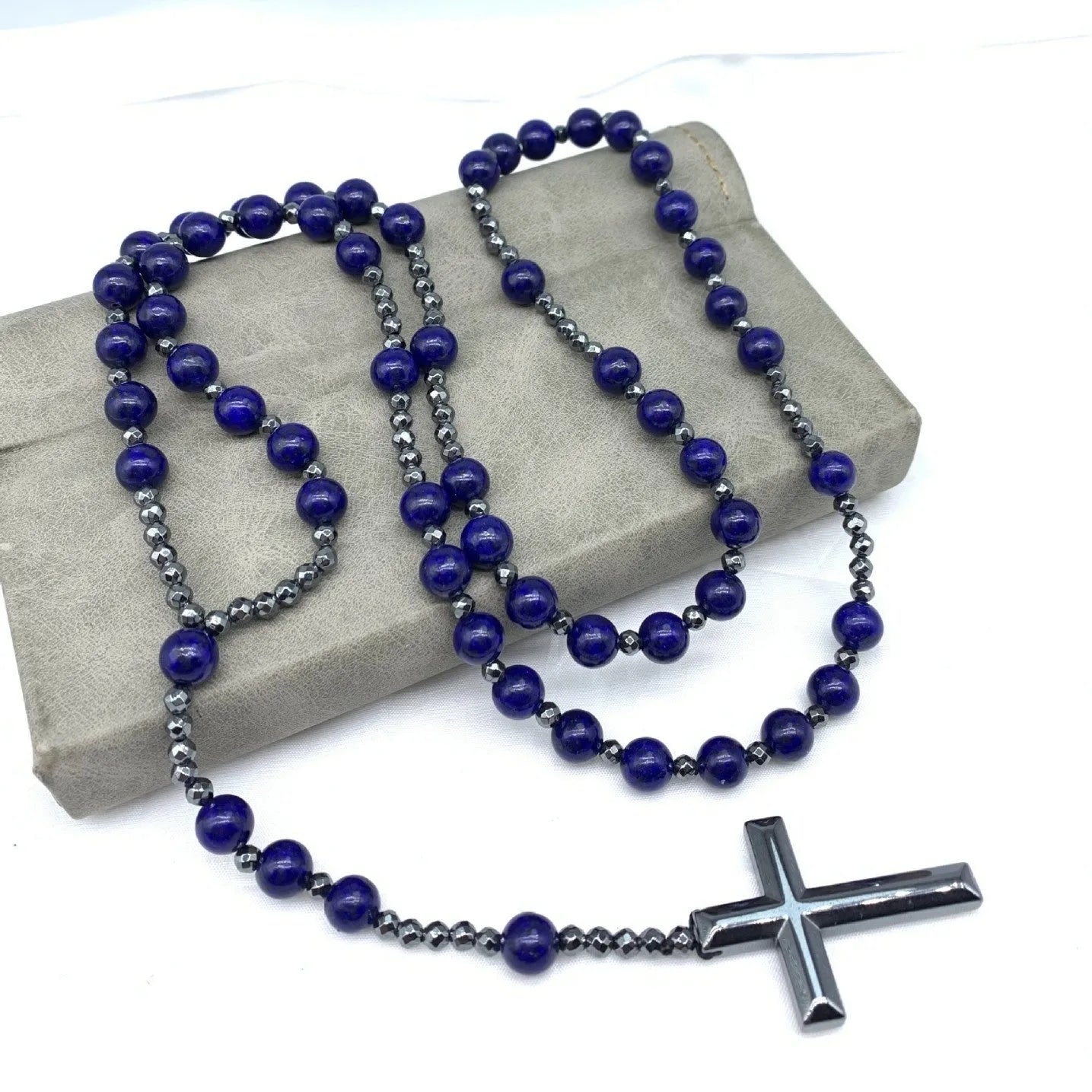 Men's stone cross pendant necklace with hand-woven detail on an 80cm ball bead chain.