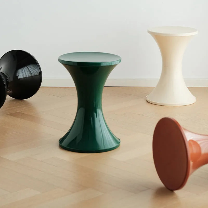 Green plastic hourglass-shaped shoe changing stool for children and adults