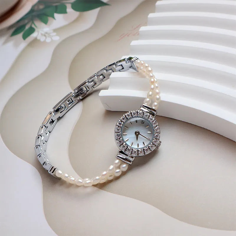 Women's light gold watch with freshwater pearl bracelet and 18mm round dial