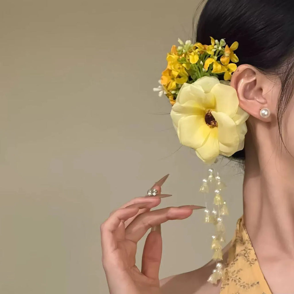 Yellow flower tassel hairpin side clip accessory on display