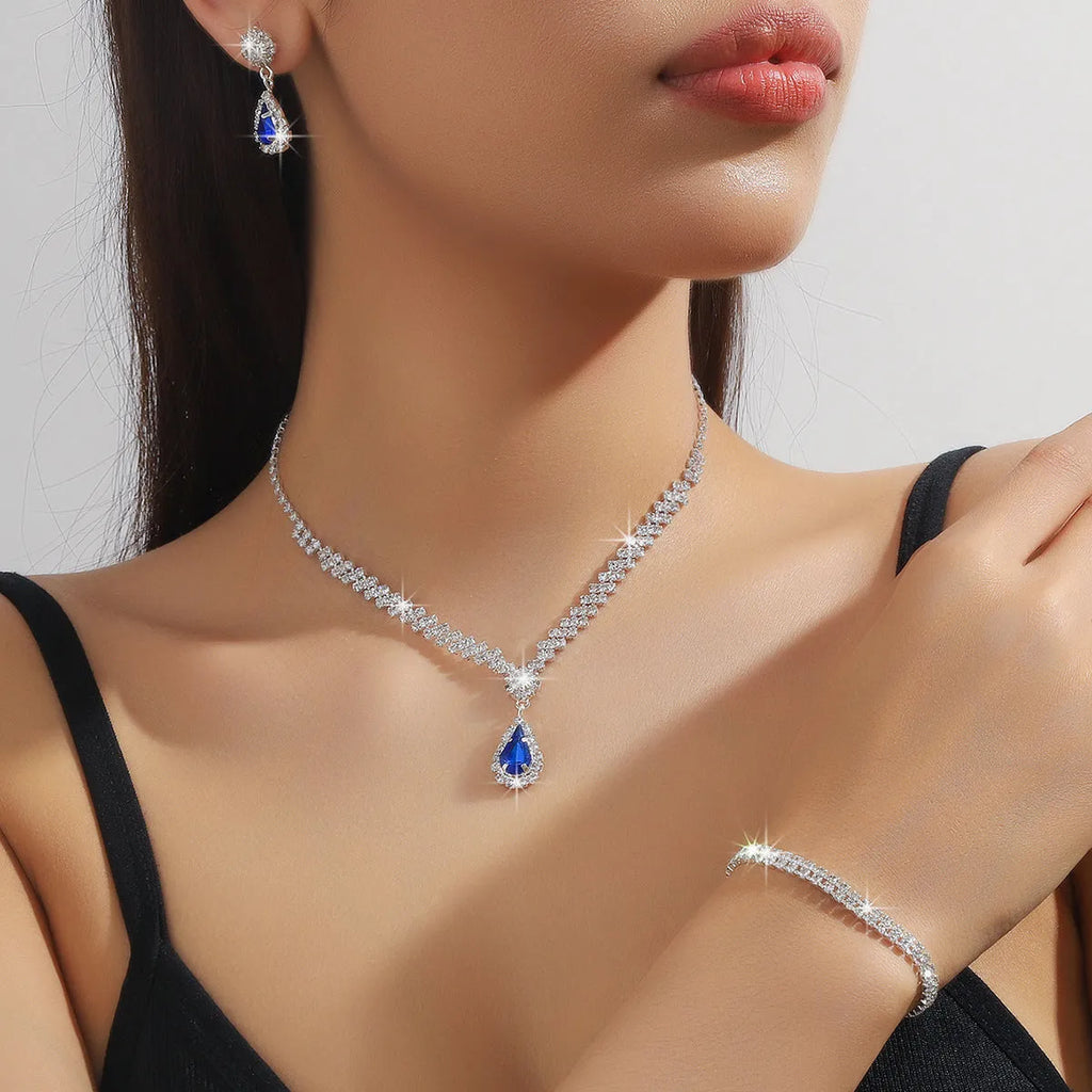 Women's claw chain necklace and earrings set with water drop rhinestones in multiple colour options