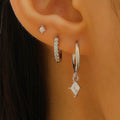 Ladies three-piece earring set with geometric zircon designs in gold and white colours