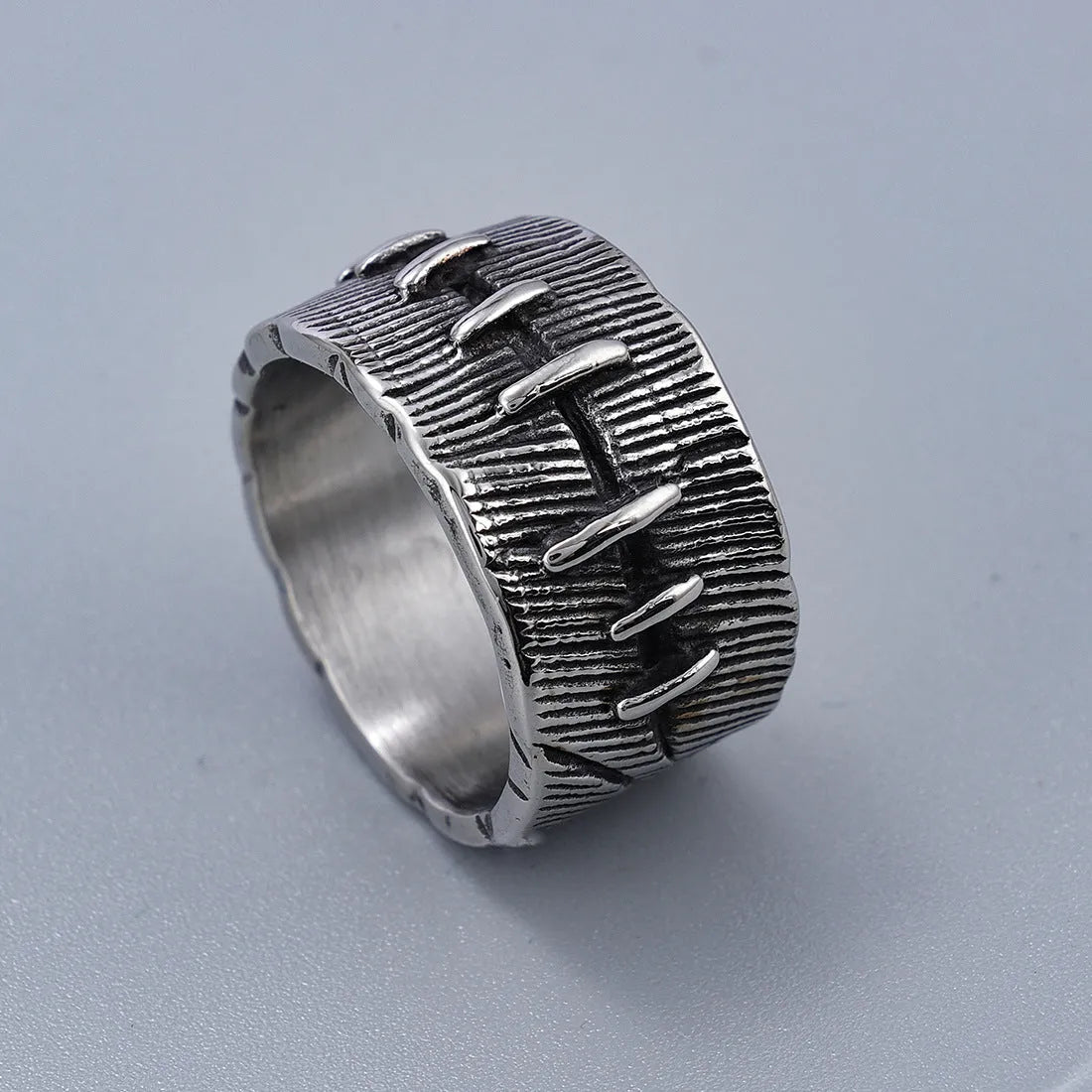 A geometric U-shaped titanium steel punk ring with a double ring design in a retro dark colour.