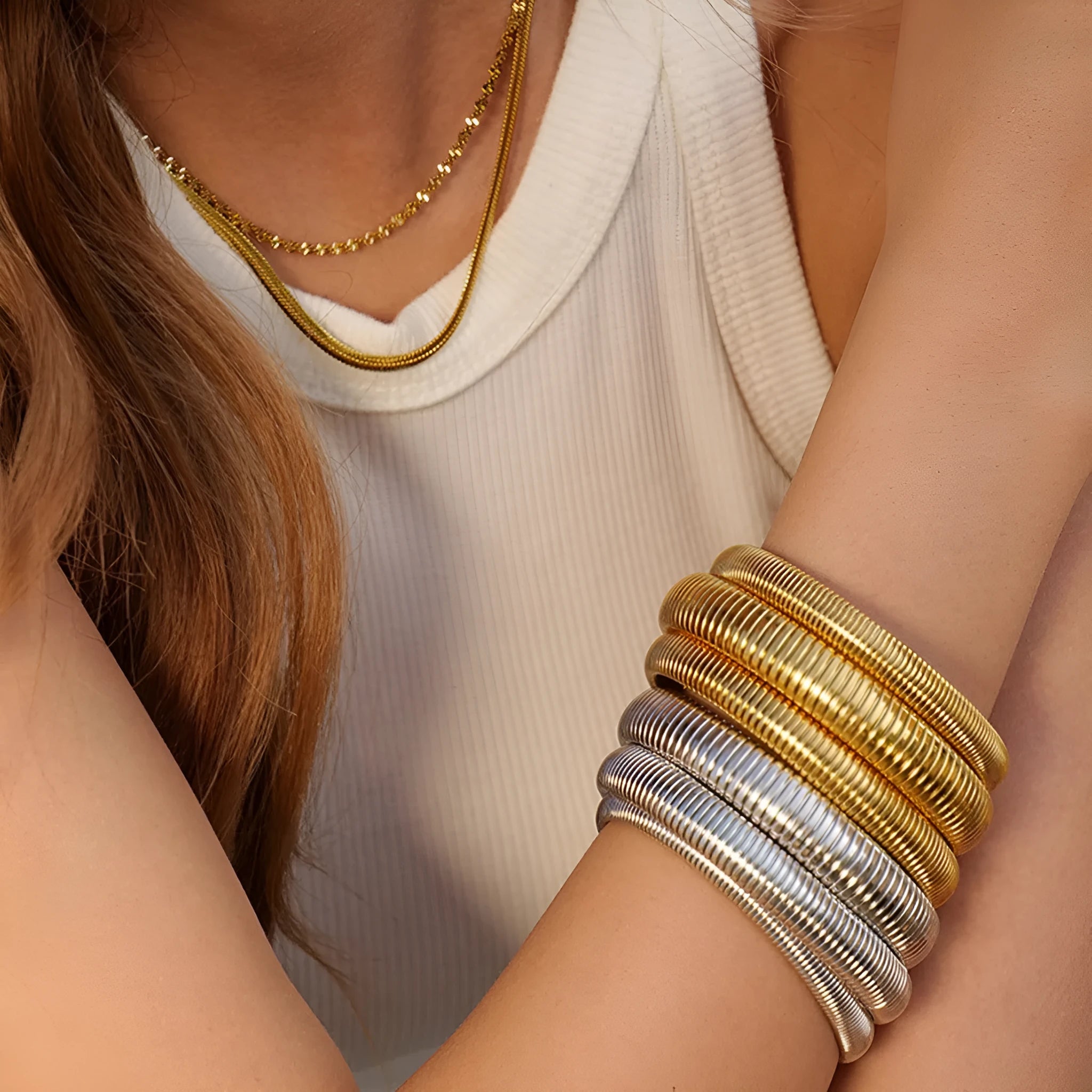 Women's titanium steel elastic bracelet with exaggerated vertical stripe pattern in gold finish