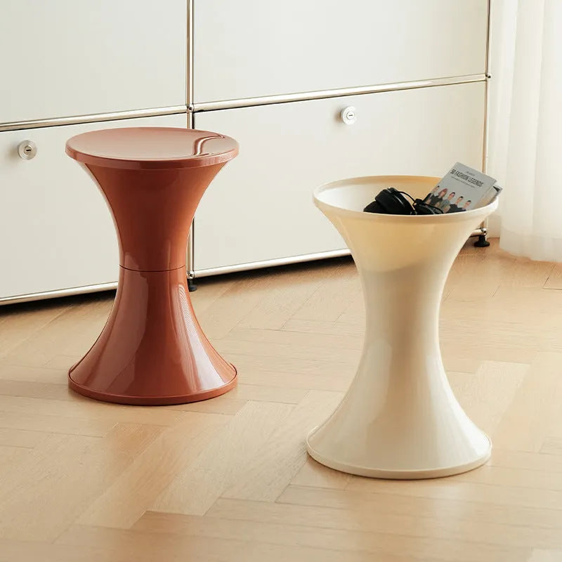 Green plastic hourglass-shaped shoe changing stool for children and adults