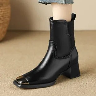 Women's brown cowhide leather Martin boots with a high heel and side zipper on a white background.