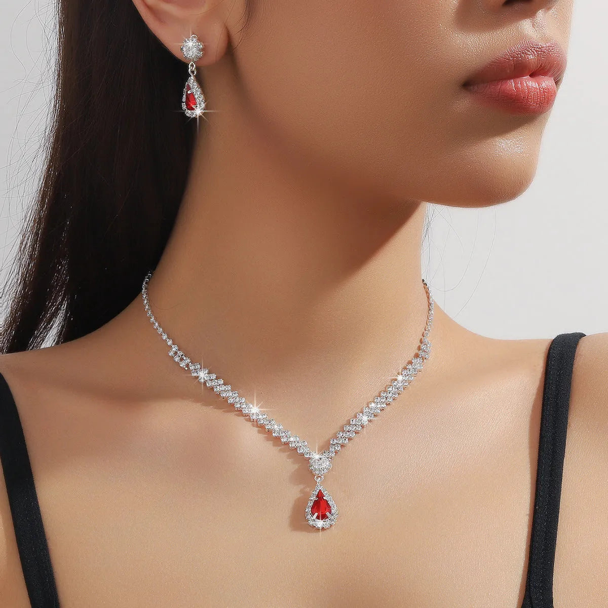 Women's claw chain necklace and earrings set with water drop rhinestones in multiple colour options