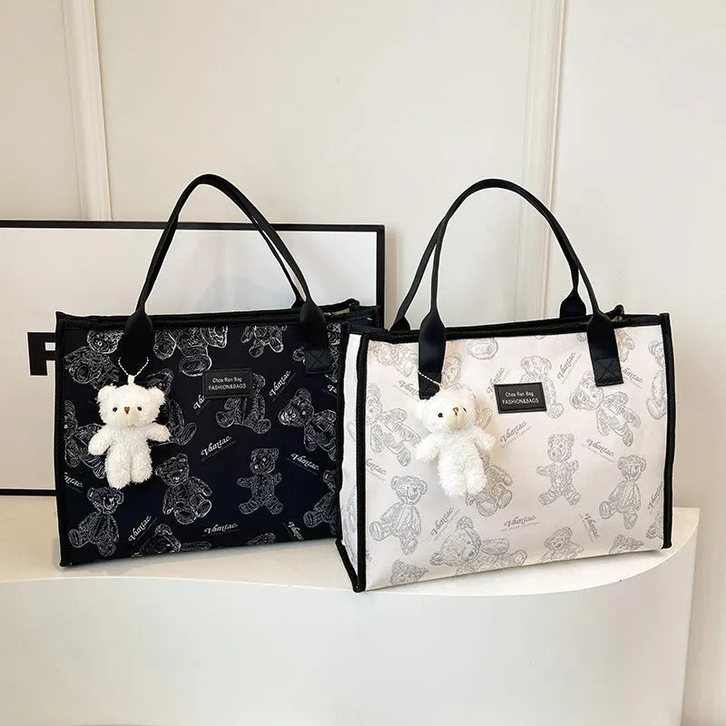 Canvas tote bag with rhombus pattern design showing sandwich pocket and shoulder strap