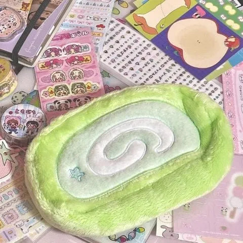 Swiss roll cake patterned velvet pencil case for stationery storage.