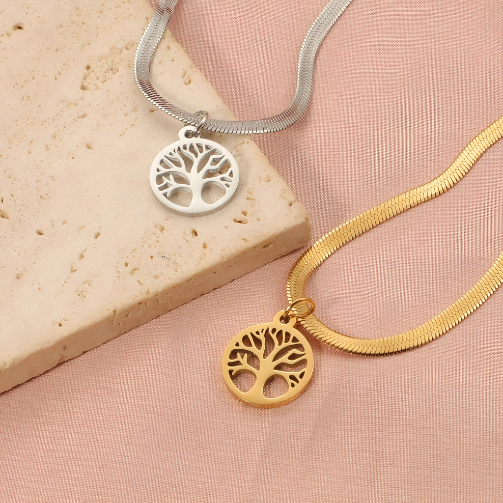Stainless steel necklace with tree pendant on snake bone chain in gold or steel colour.