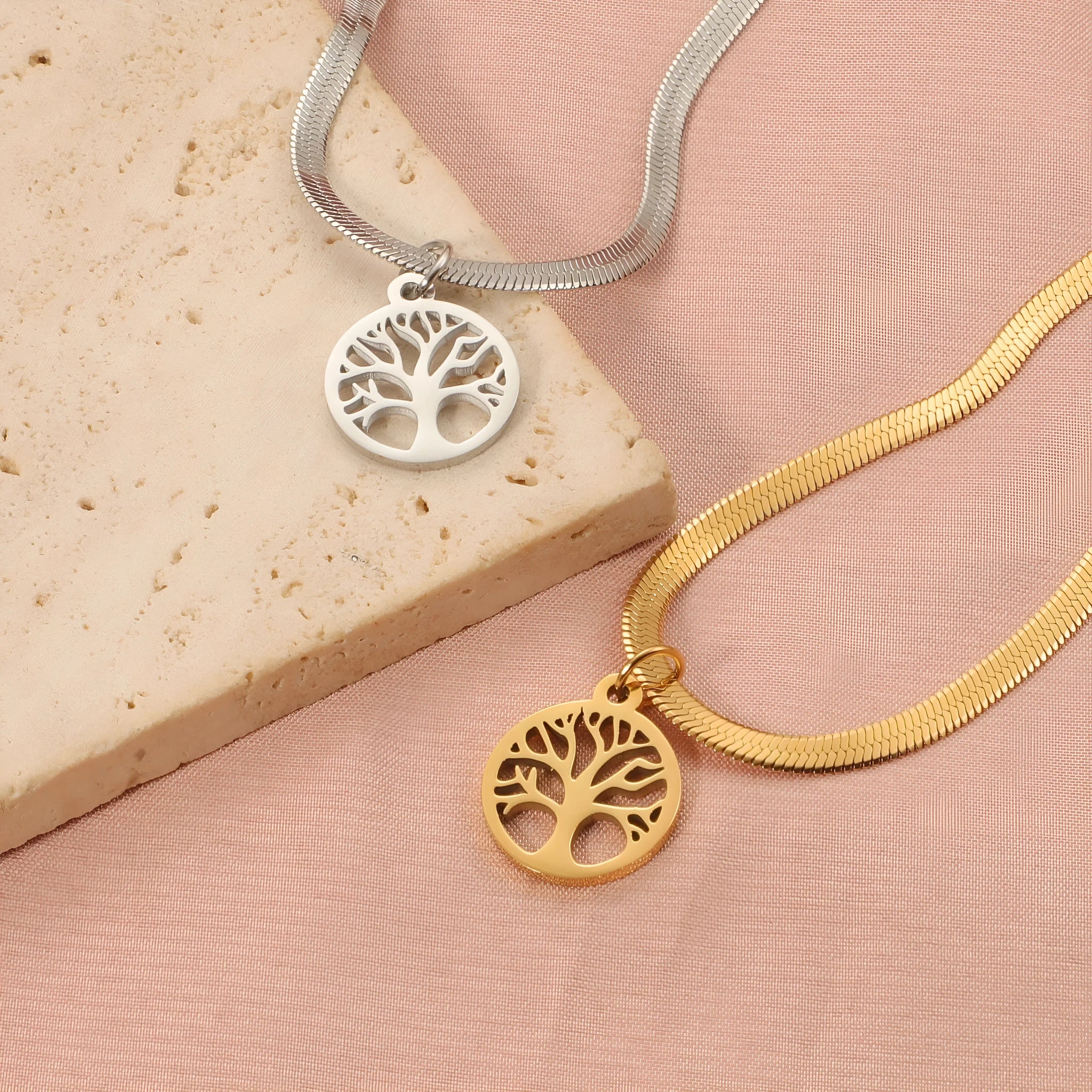 Stainless steel necklace with tree pendant on snake bone chain in gold or steel colour.
