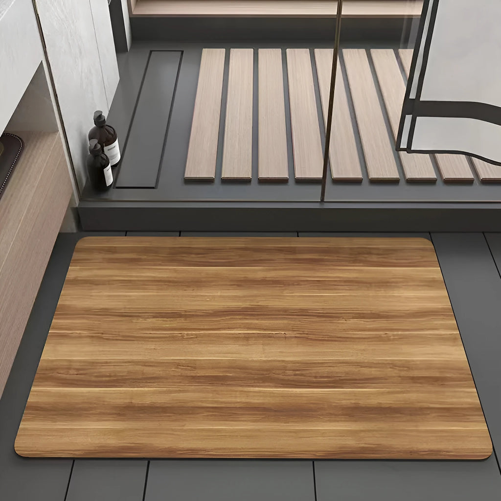 Square American style wood grain patterned diatom ooze bathroom floor mat on a tiled floor.
