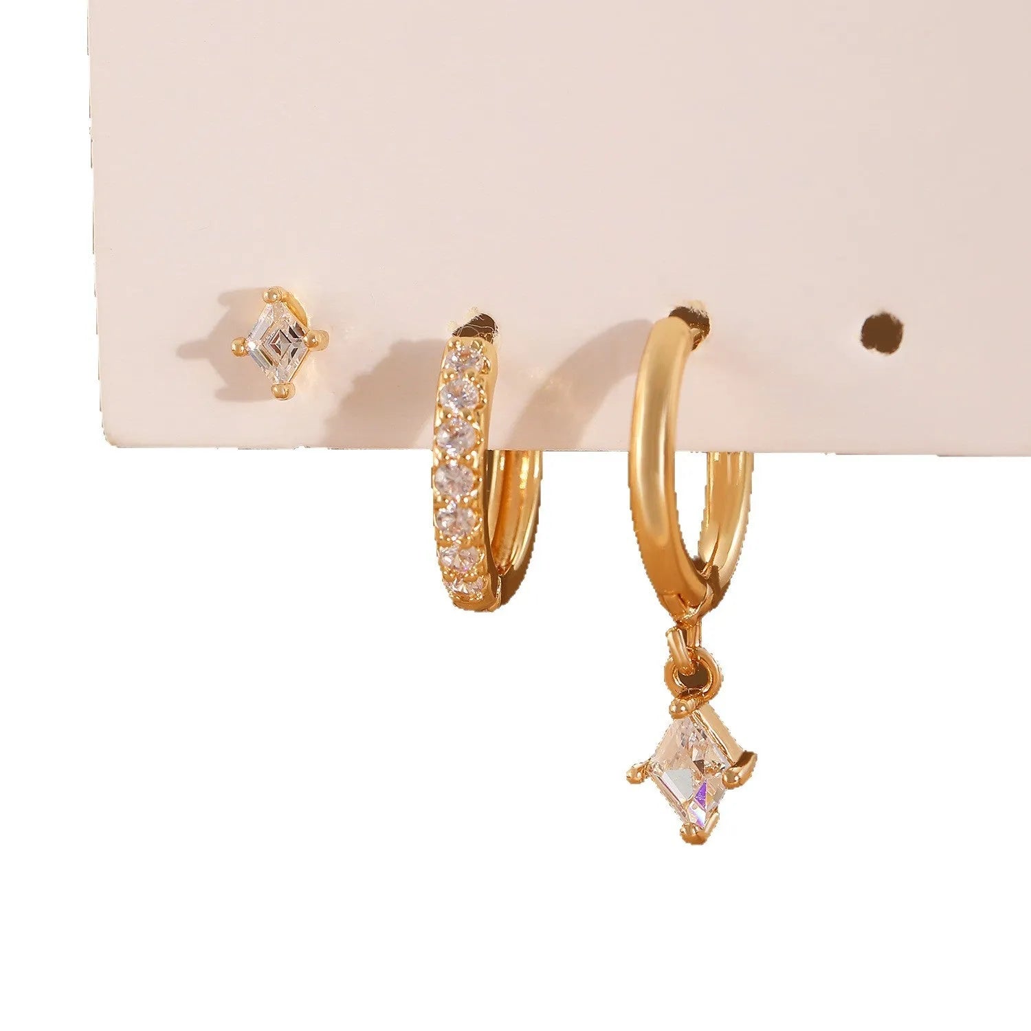 Ladies three-piece earring set with geometric zircon designs in gold and white colours