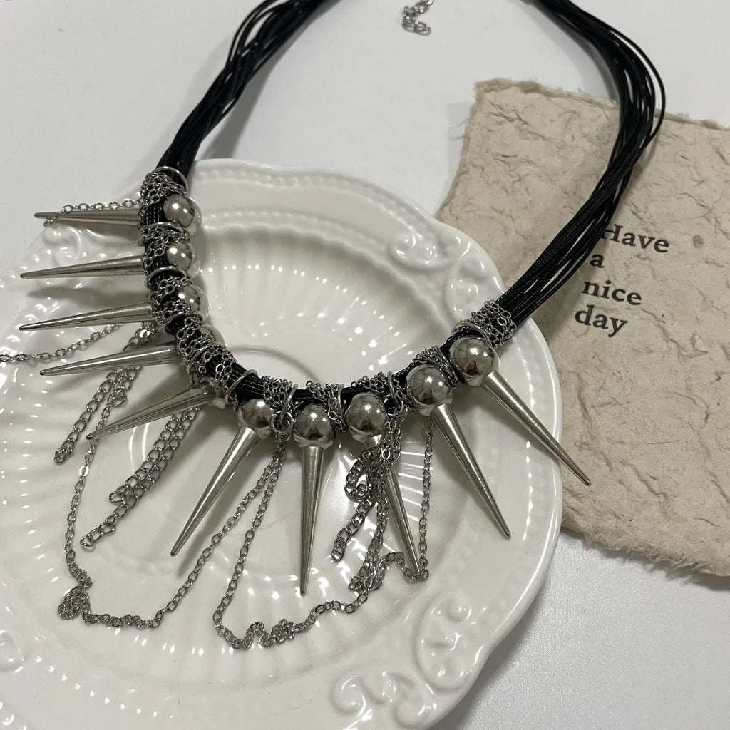 Genuine leather tassel necklace with electroplated rivet details and round beads