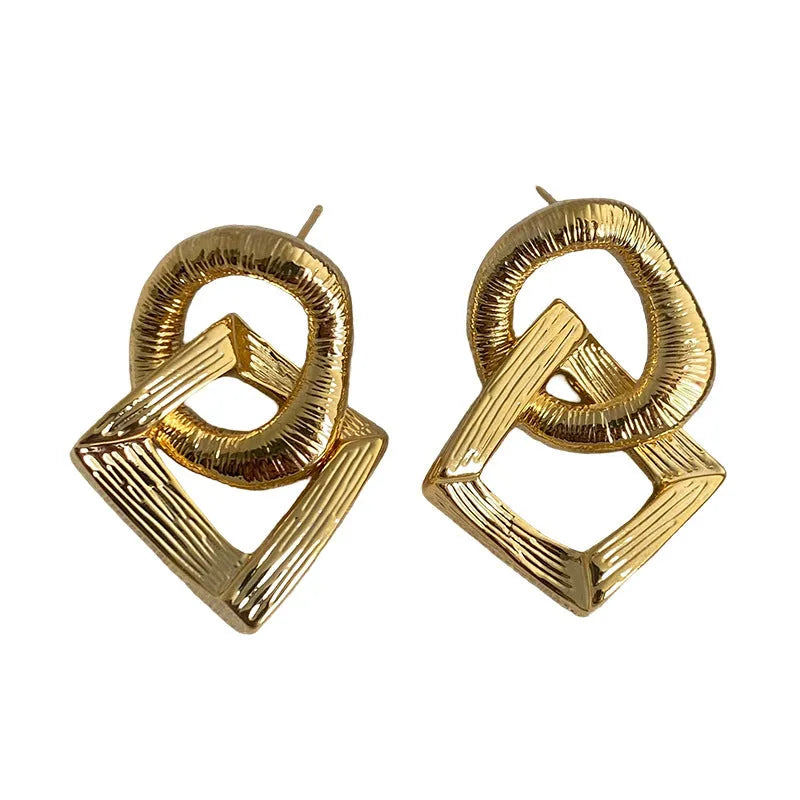 Retro geometric circle pendant earrings in gold or silver finish with 3.4cm drop length
