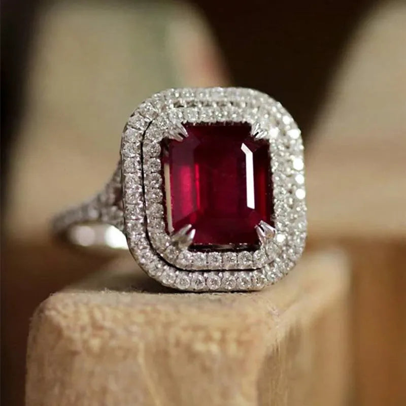 Copper women's ring with square red rhinestone on geometric princess-shaped band