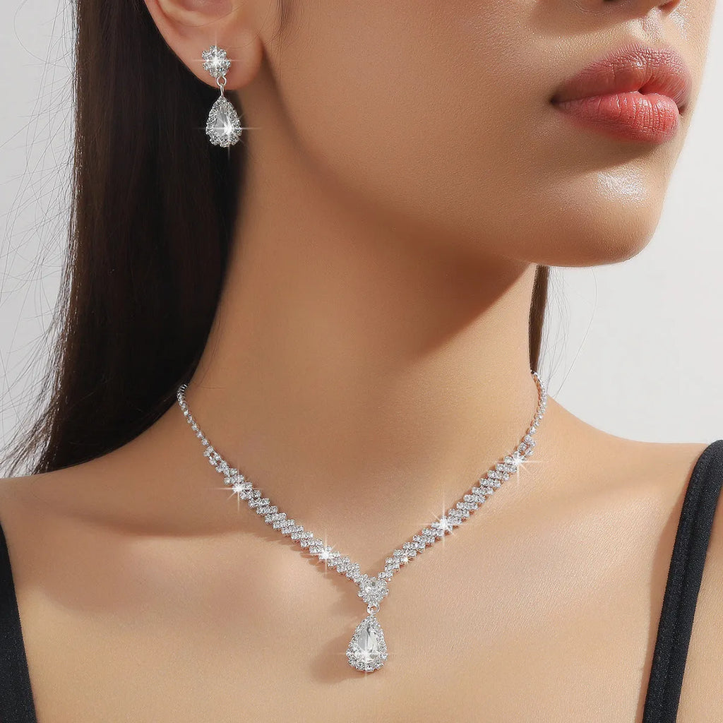 Women's claw chain necklace and earrings set with water drop rhinestones in multiple colour options