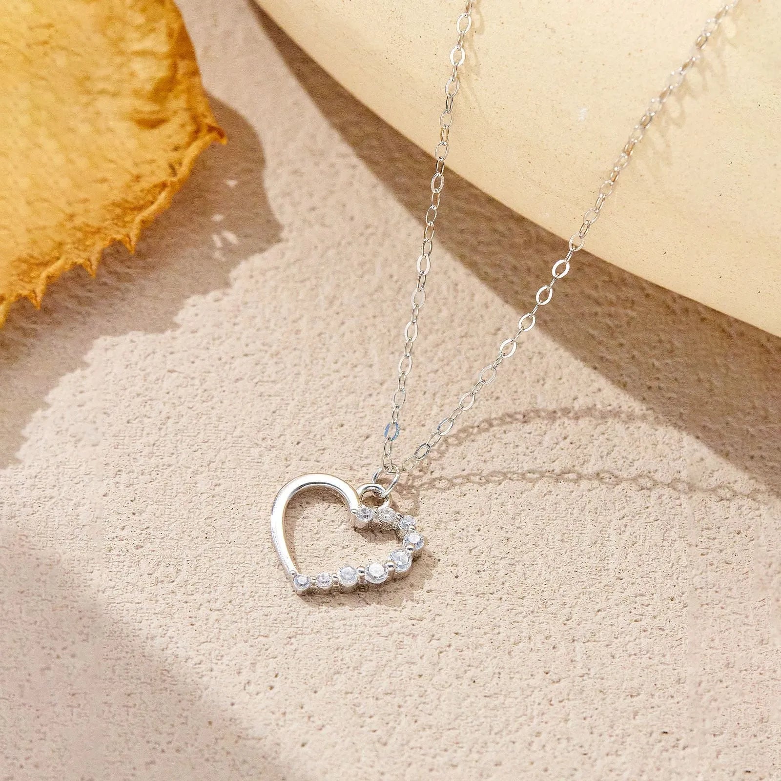 925 sterling silver hollow heart necklace with regular chain, available in white gold or platinum colour