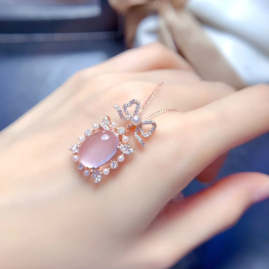Rose gold plated geometric silver necklace with a pink rose quartz crystal pendant.