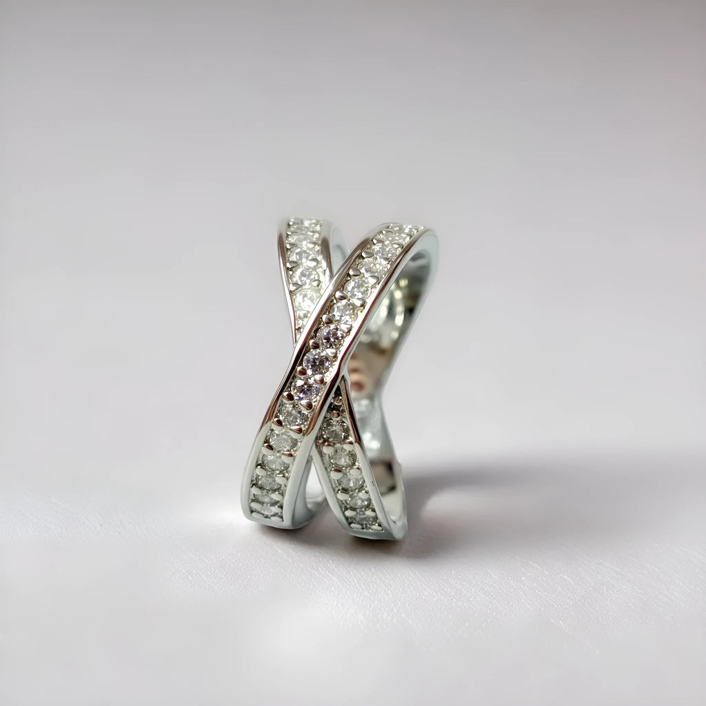 Electroplated copper cross ring with micro-inlaid zircon stones in silver finish