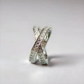 Electroplated copper cross ring with micro-inlaid zircon stones in silver finish