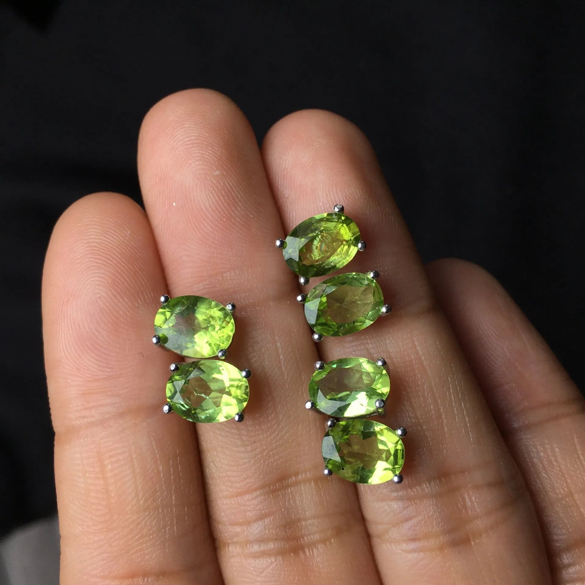 Natural olivine stud earrings with grass green oval stones in sterling silver setting