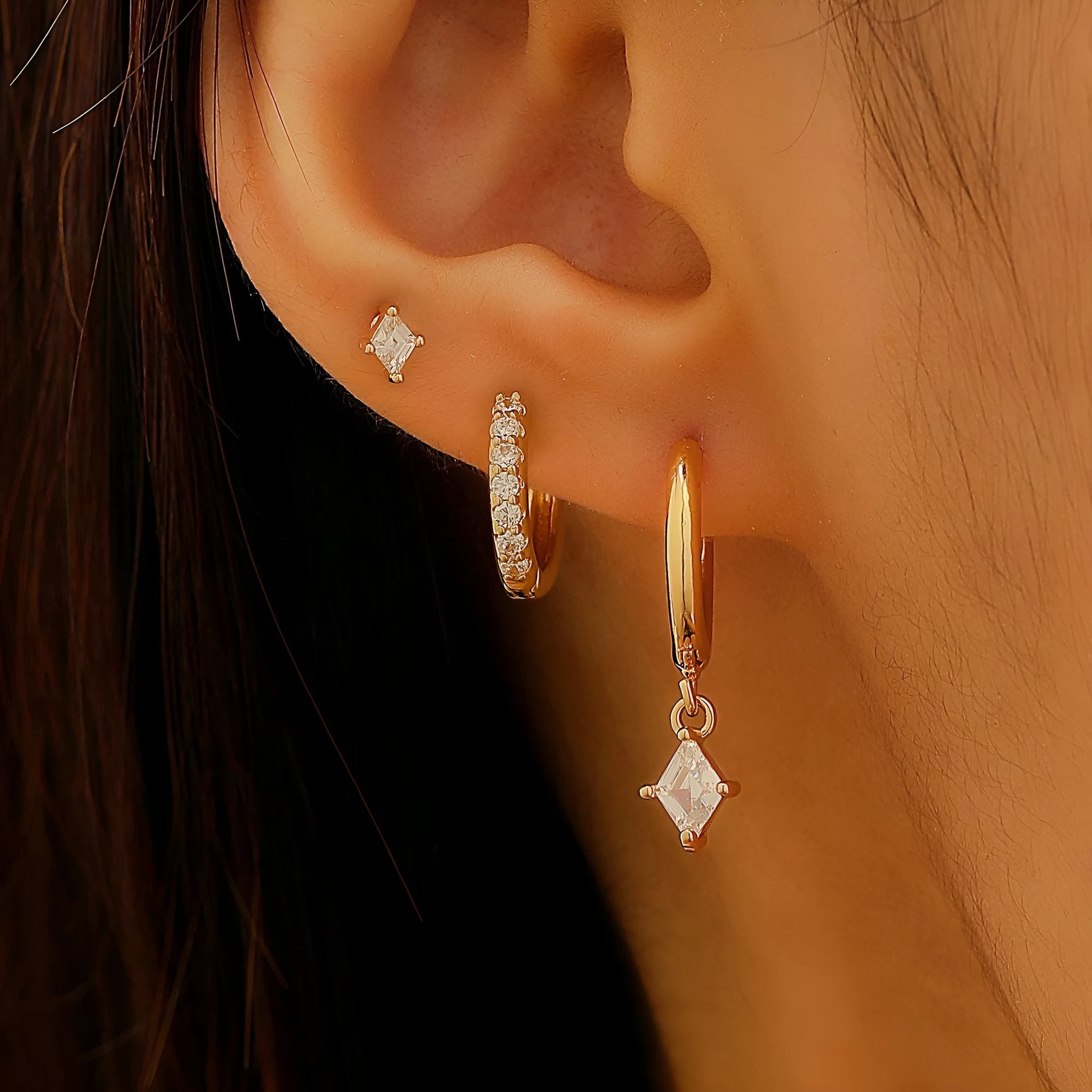 Ladies three-piece earring set with geometric zircon designs in gold and white colours