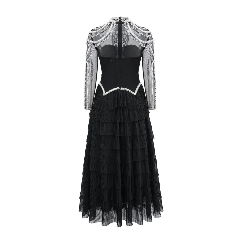 Women's black polyester dress with long sleeves, decorative beadwork, and mid waist design