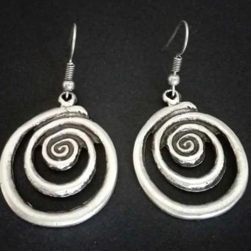 Silver geometric spiral earrings with distressed finish measuring 2.6cm by 5cm