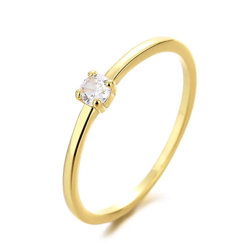 Women's fine copper circle ring with geometric design and single diamond in multiple colour options