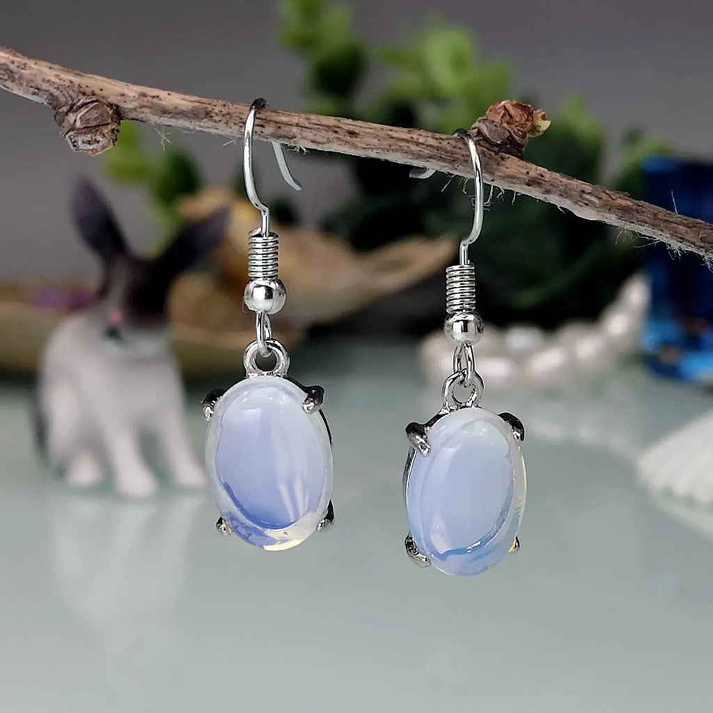 Moonlight white opal earrings with electroplated alloy drop shape design and ellipse silhouette elements