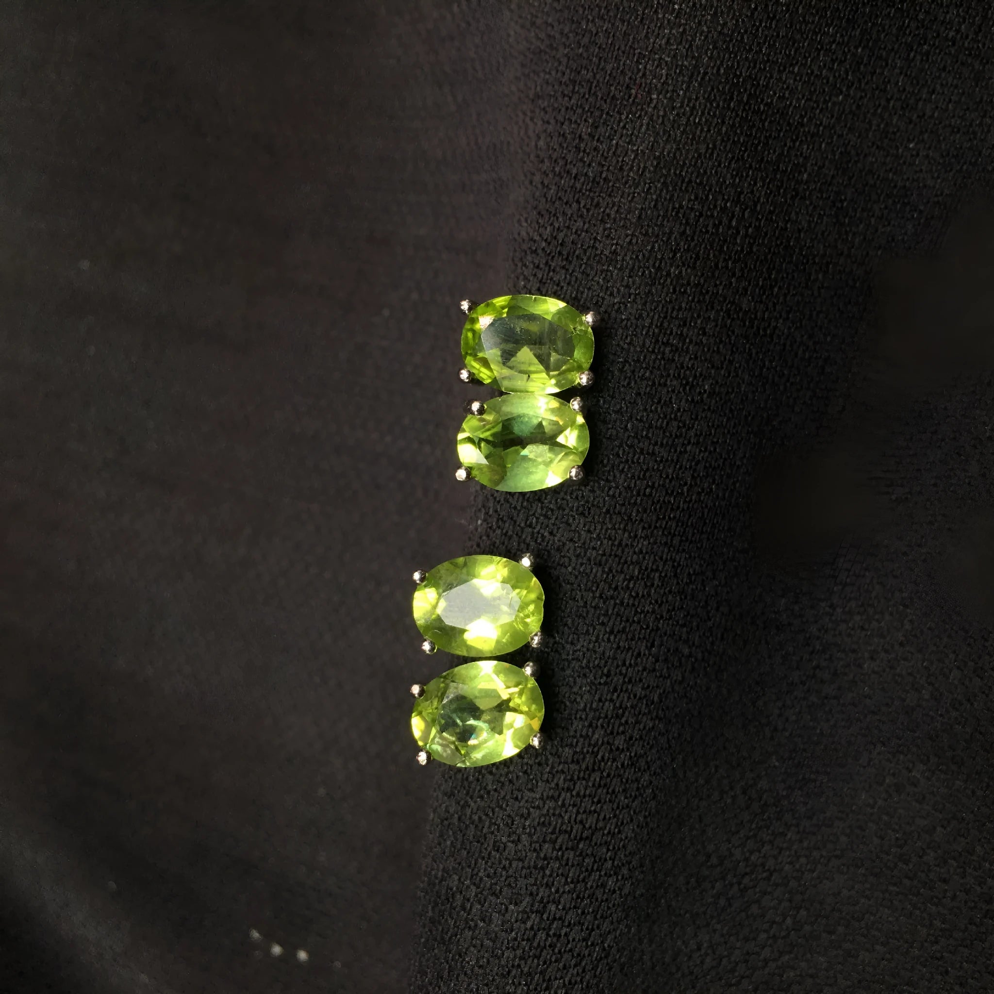Natural olivine stud earrings with grass green oval stones in sterling silver setting