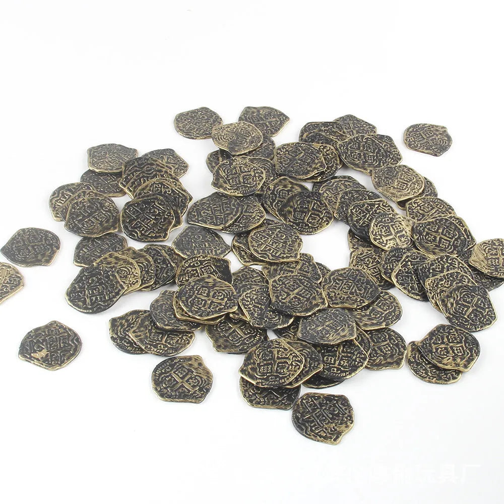 Three piles of Roman pirate coins showing bronze, gold and silver electroplated finishes on plastic bases