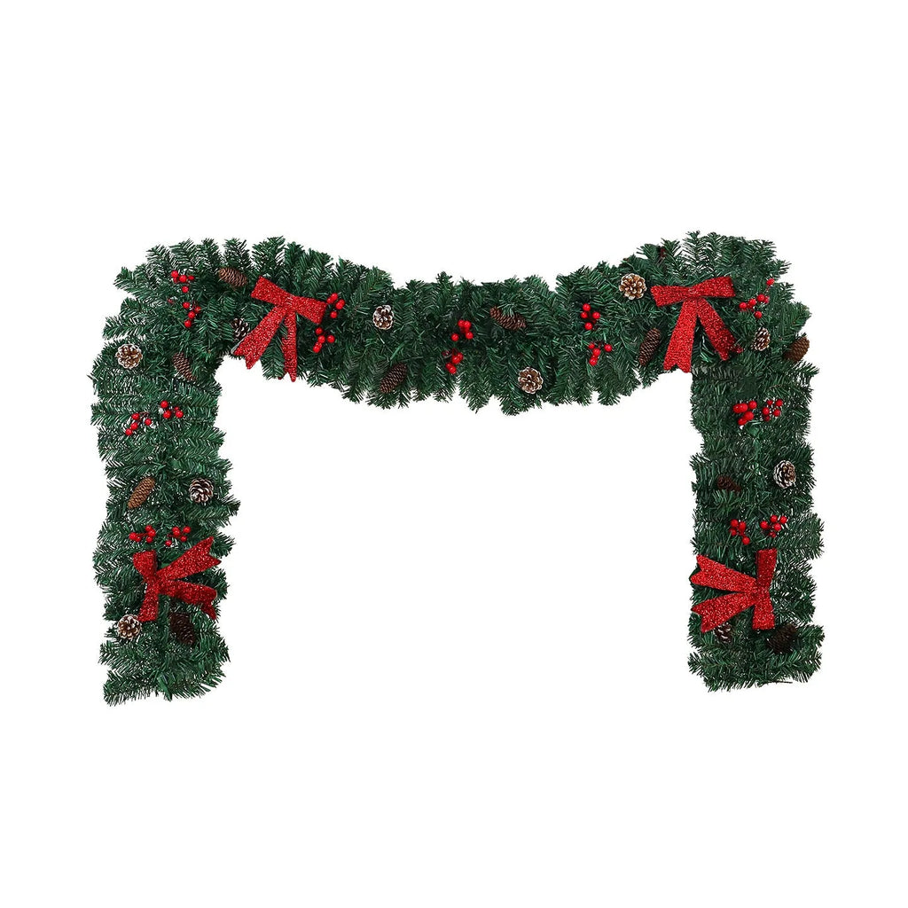 Christmas rattan pine cone bow decorative centrepiece with LED lighting on wooden table