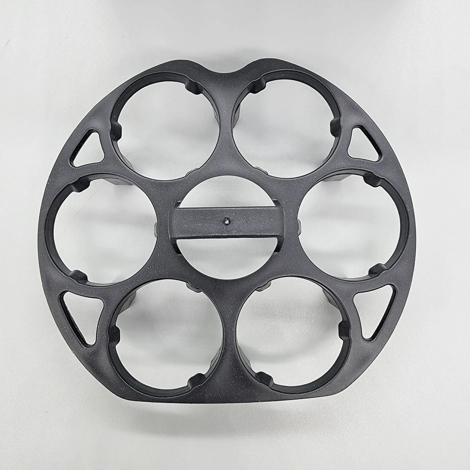 Black plastic egg holder basket with dimensions 13.8 by 12.6 cm.