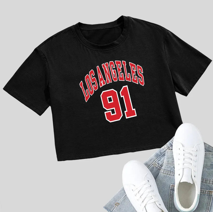 A loose-fit black cotton t-shirt with printed white English letters and an exposed navel design.