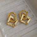 Retro geometric circle pendant earrings in gold or silver finish with 3.4cm drop length