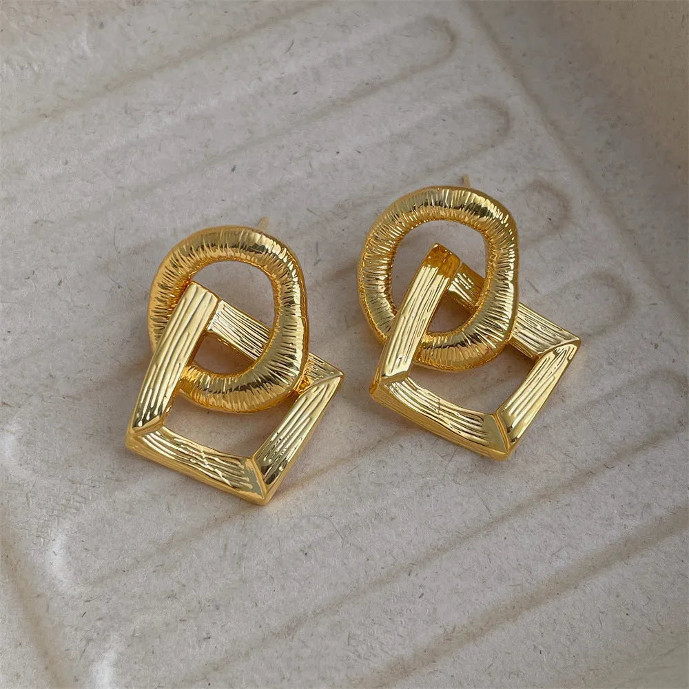 Retro geometric circle pendant earrings in gold or silver finish with 3.4cm drop length