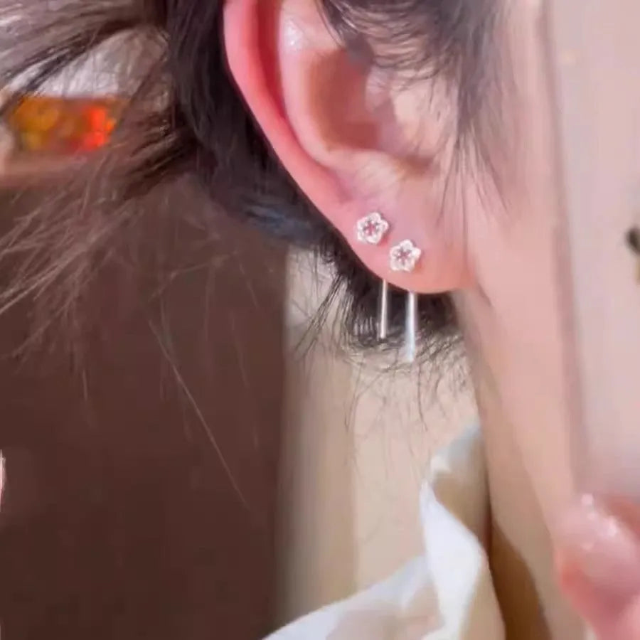 Silver colour hollow flower hanging earrings with natural petal design