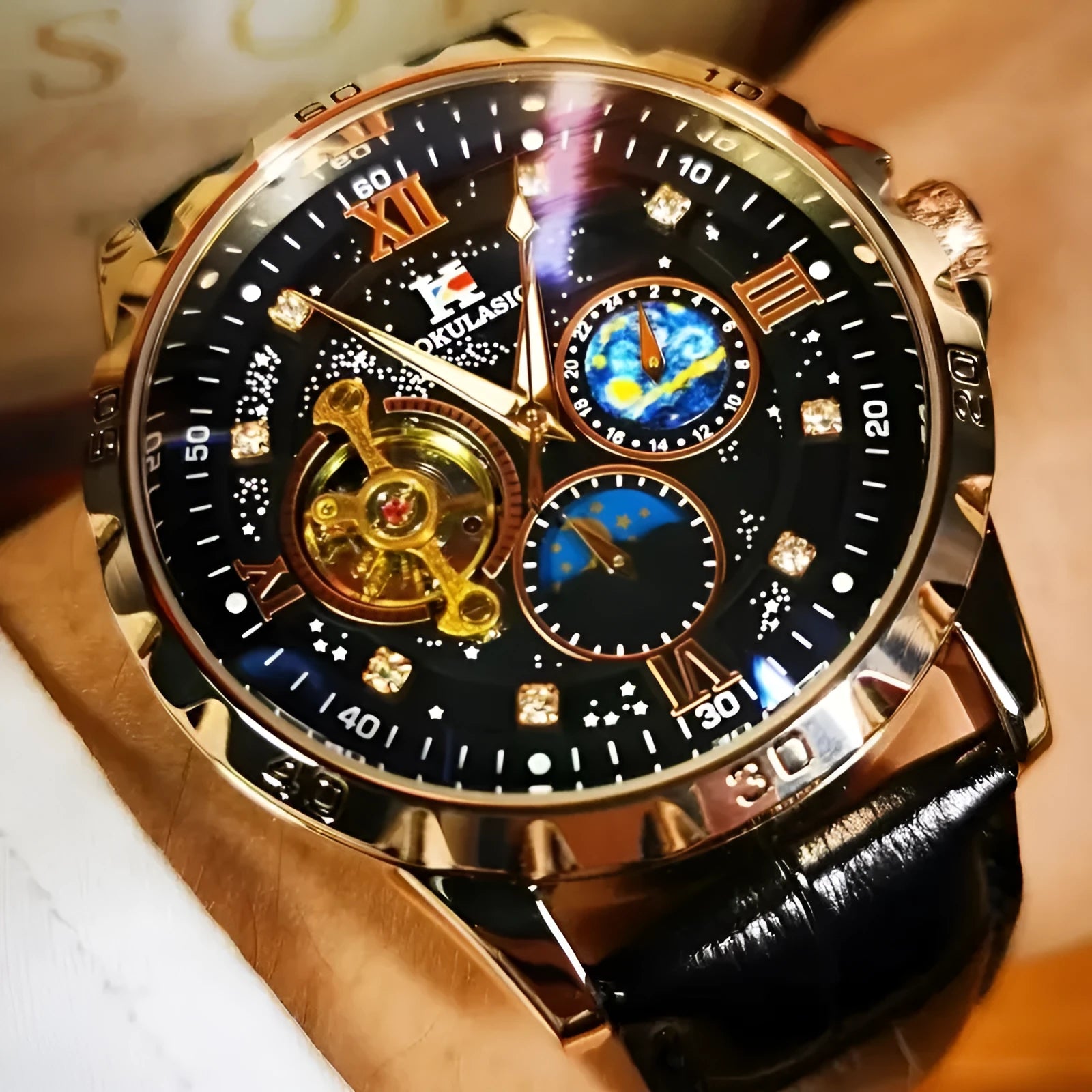 Automatic mechanical watch with large hollow dial showing movement, rose gold case, black face, leather strap