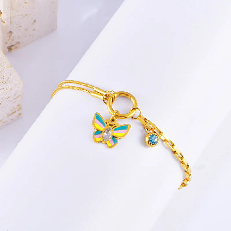 Gold tone epoxy butterfly necklace and bracelet set with snake bone chain.
