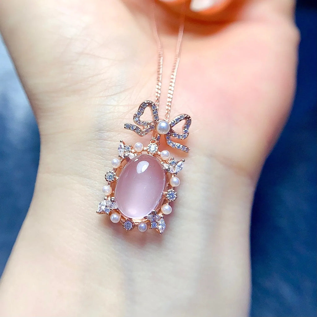 Rose gold plated geometric silver necklace with a pink rose quartz crystal pendant.