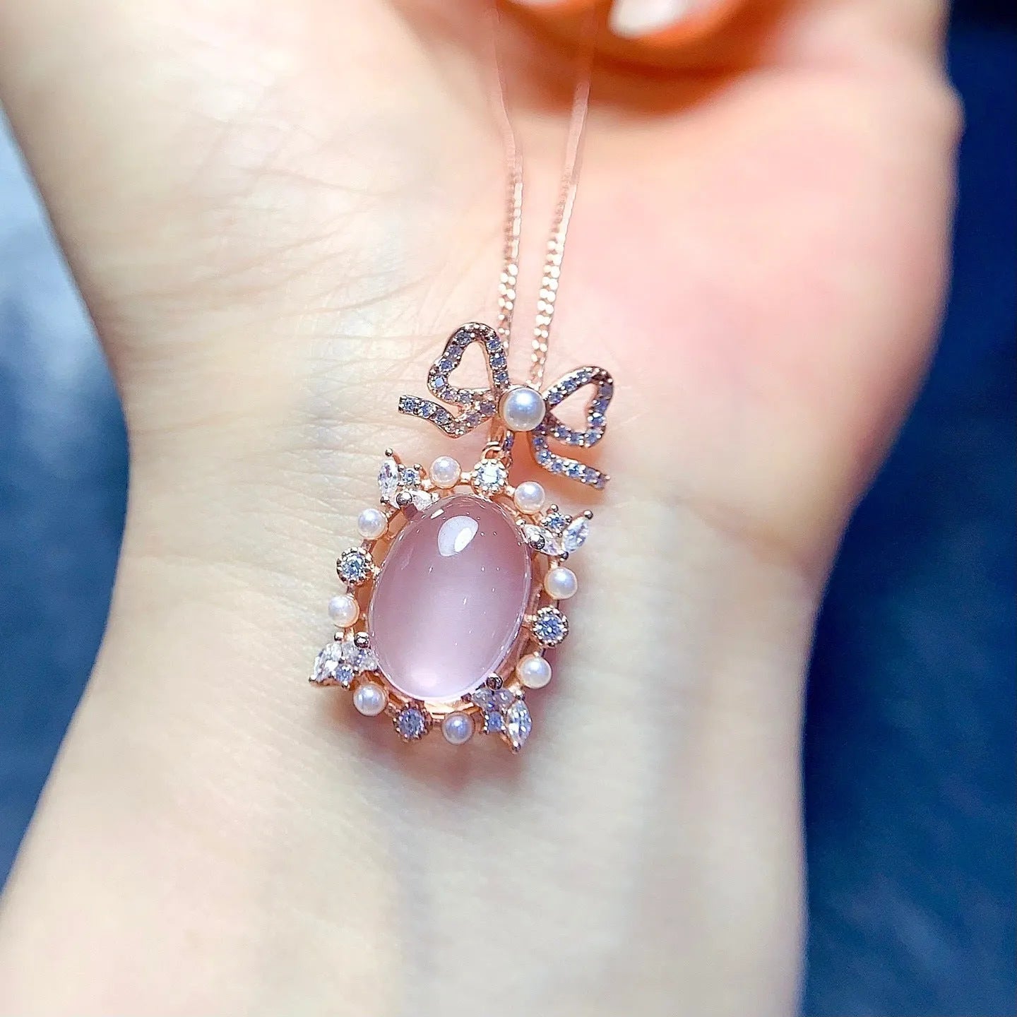 Rose gold plated geometric silver necklace with a pink rose quartz crystal pendant.