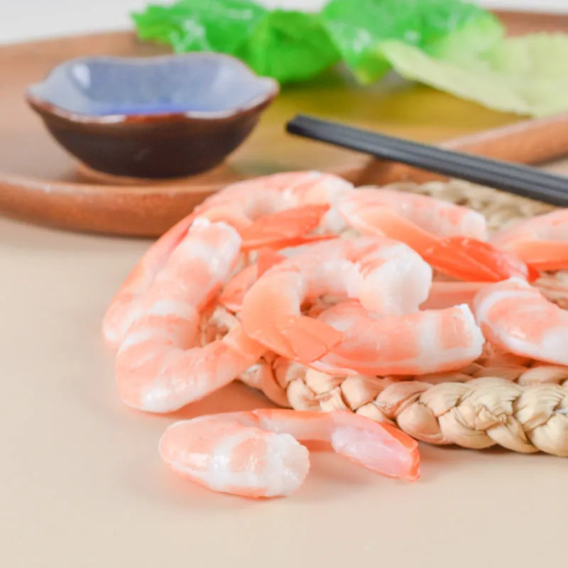 PVC injection moulded shrimp-shaped keychain with modern minimalist design