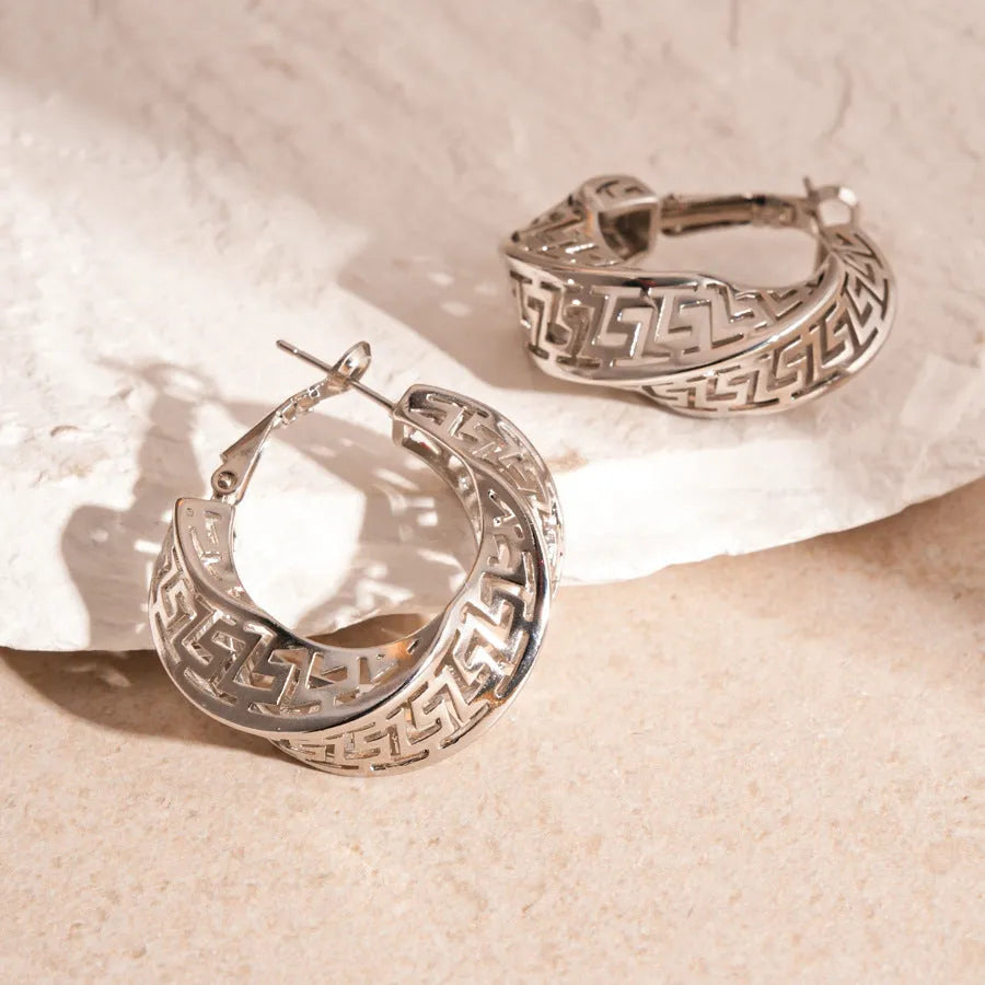 Twisted geometric hollow stud earrings in silver and gold electroplated finishes